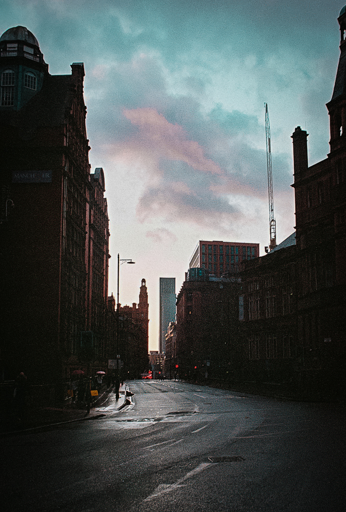 Looking down Sackville Street in Manchester, towards the Deansgate Square towers at sunset